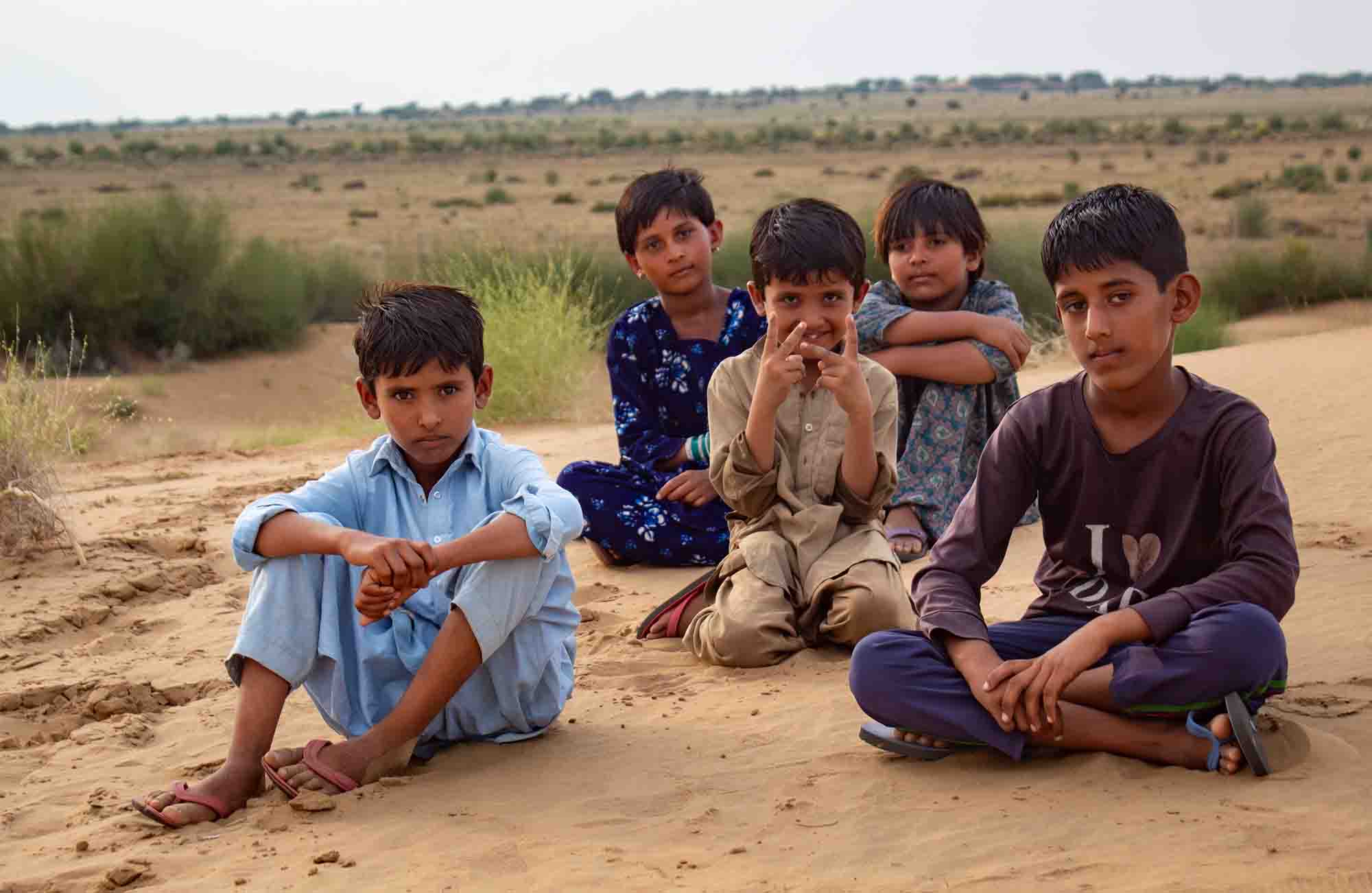 Children of the Thar Desert near Kuldhara Village, showcasing rural life in Rajasthan