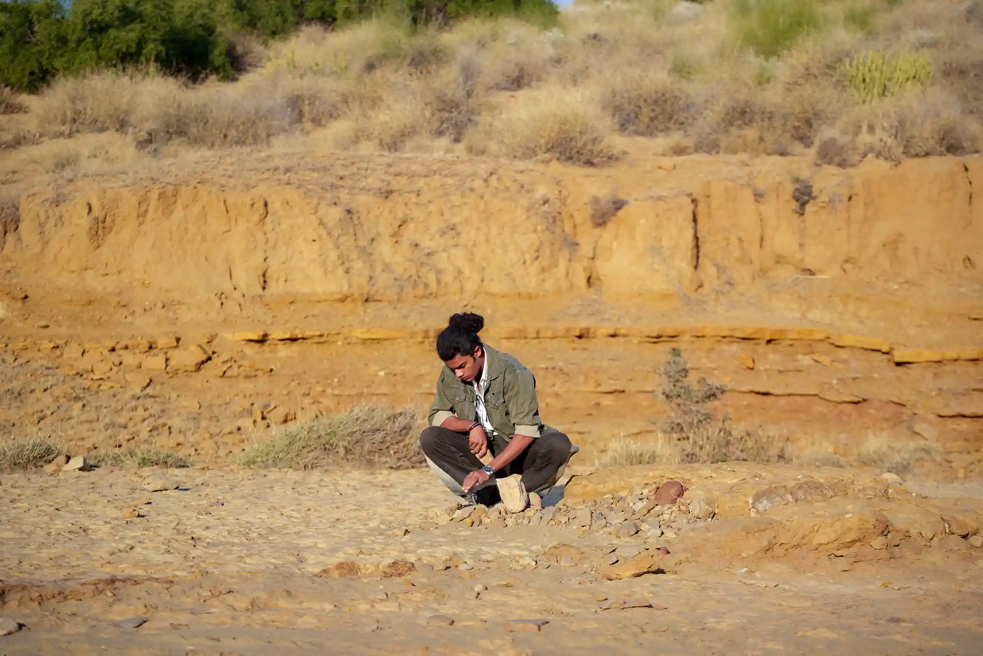 Guests discovering fossils during desert walk near Kuldhara Dreamtime Bungalow